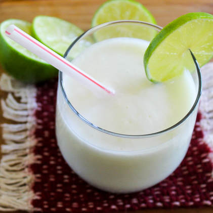 Eight ounce glass lime yogurt smoothie.
