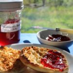 Manzanita blossom jelly in jar spread on English muffin