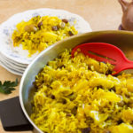 Serving curry cabbage onto plate