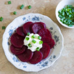 Pickled beets served with optional dollop of sour cream.
