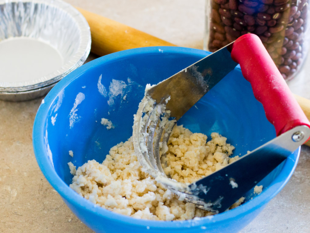 Flour, shortening and salt blended in blue bowl