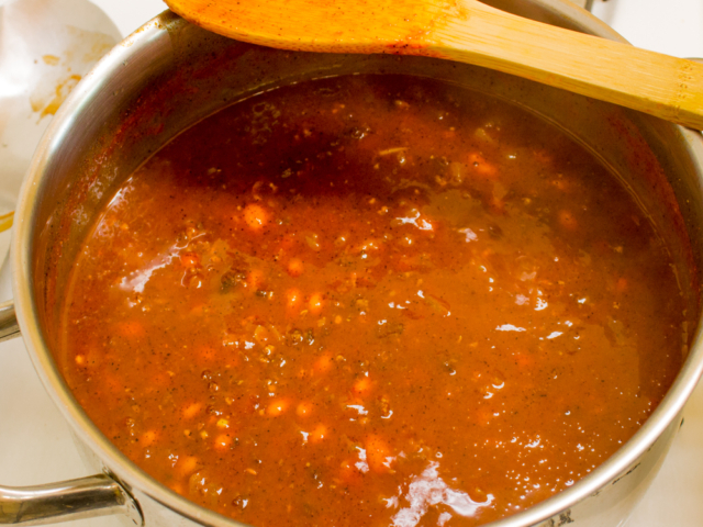 Return to heat and stir slowly until chili thickens.