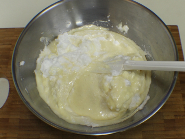 Egg whites folded into batter in bowl