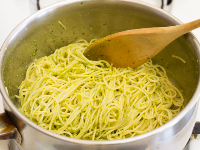 Stir basil pesto into pasta.
