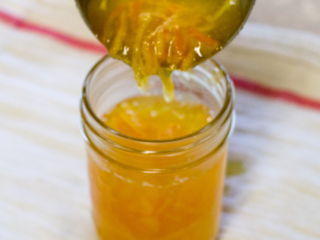 Marmalade being poured into jar