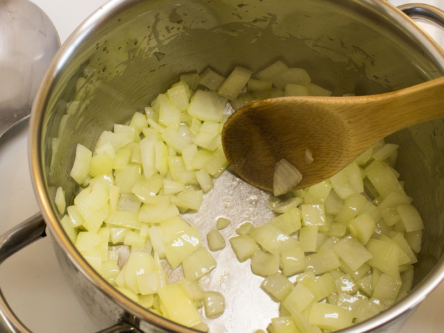 Onions and olive oil in pot.