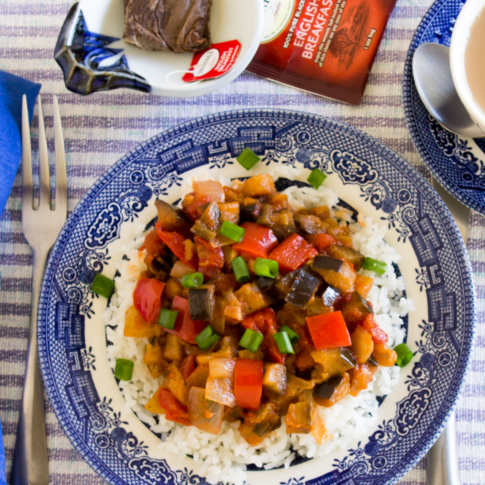 Plate of Sweet and Sour Savory Eggplant on rice.