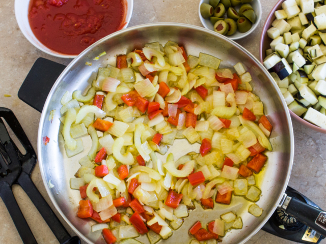 Vegetables cooking in frying pan.
