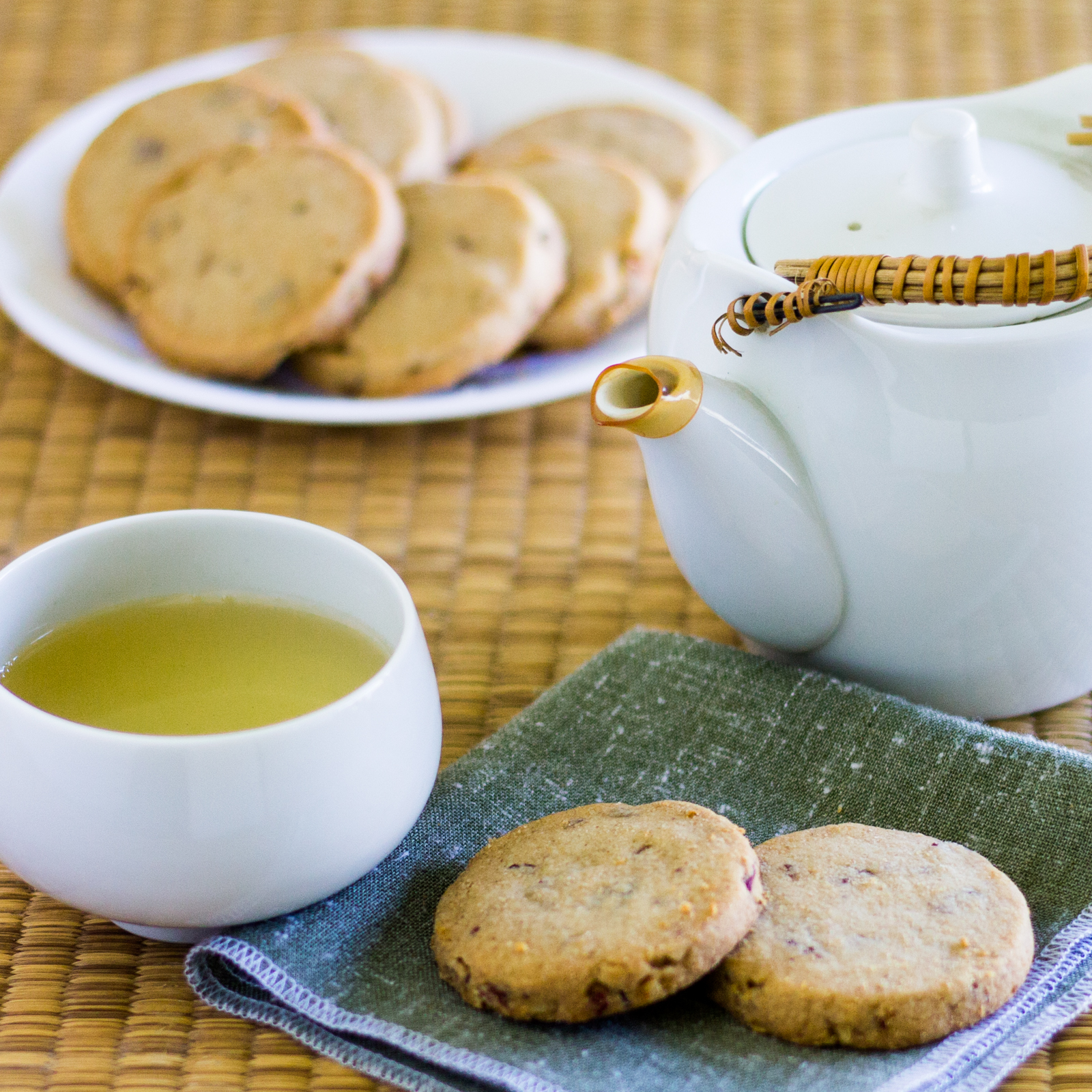 Vegan pecan shortbread cookies with cup of green tea.