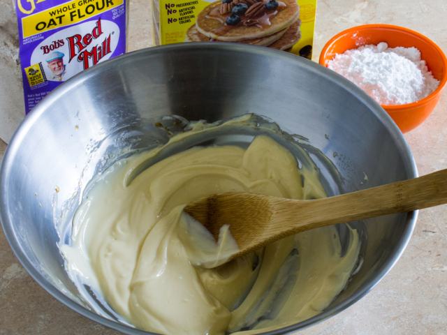 Butter and vanilla extract mixed together in bowl.