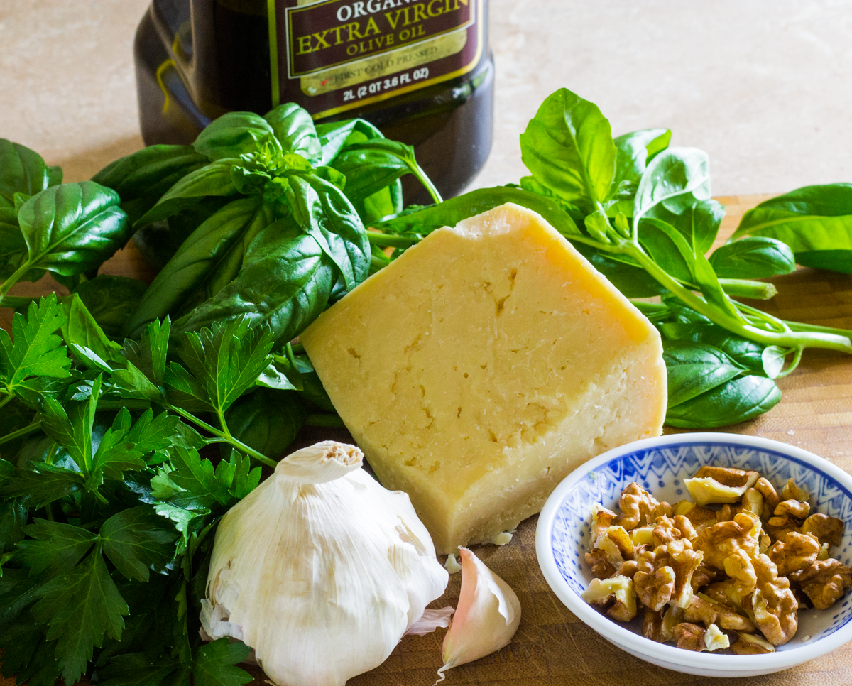 Ingredients for pesto - basil garlic walnuts Parmesan cheese parsley olive oil