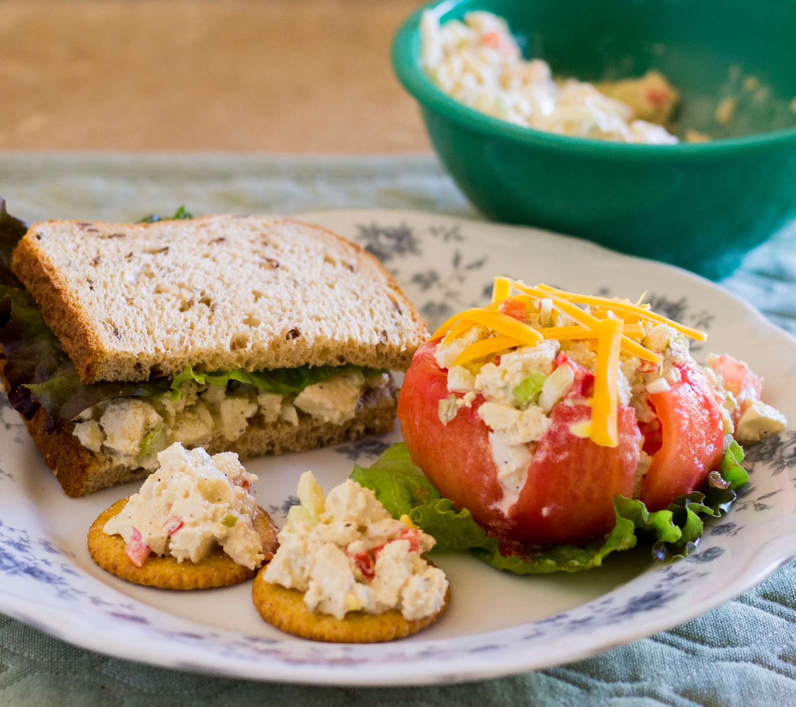 Vegetarian chicken salad tofu in sandwich, on crackers, and in stuffed tomato
